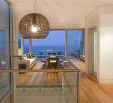 Interior of house with evening view and doors installed with heavy duty aluminium stacking doors