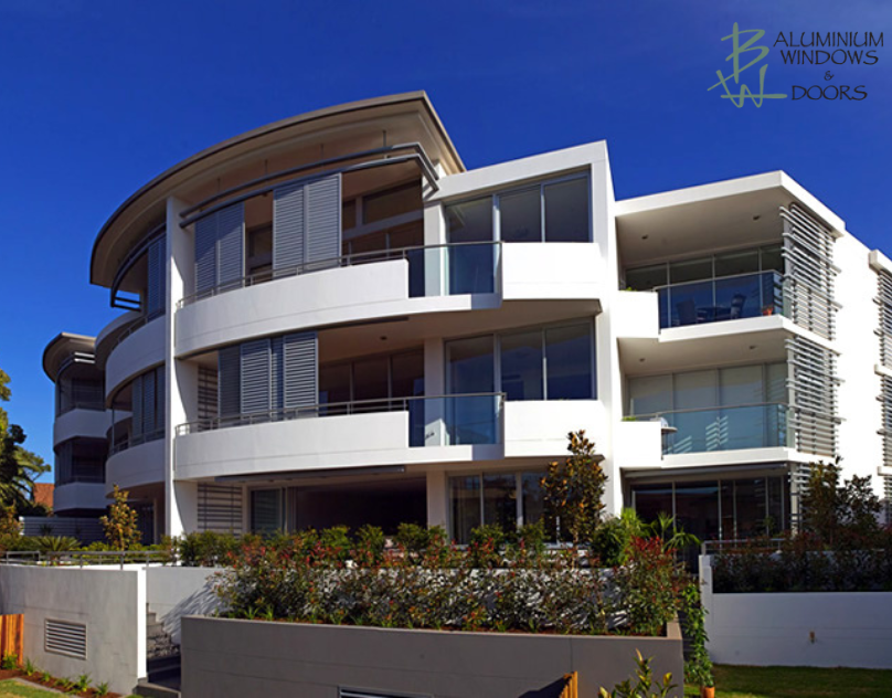 Woman Standing by Bedroom Window and Opening Curtains. 